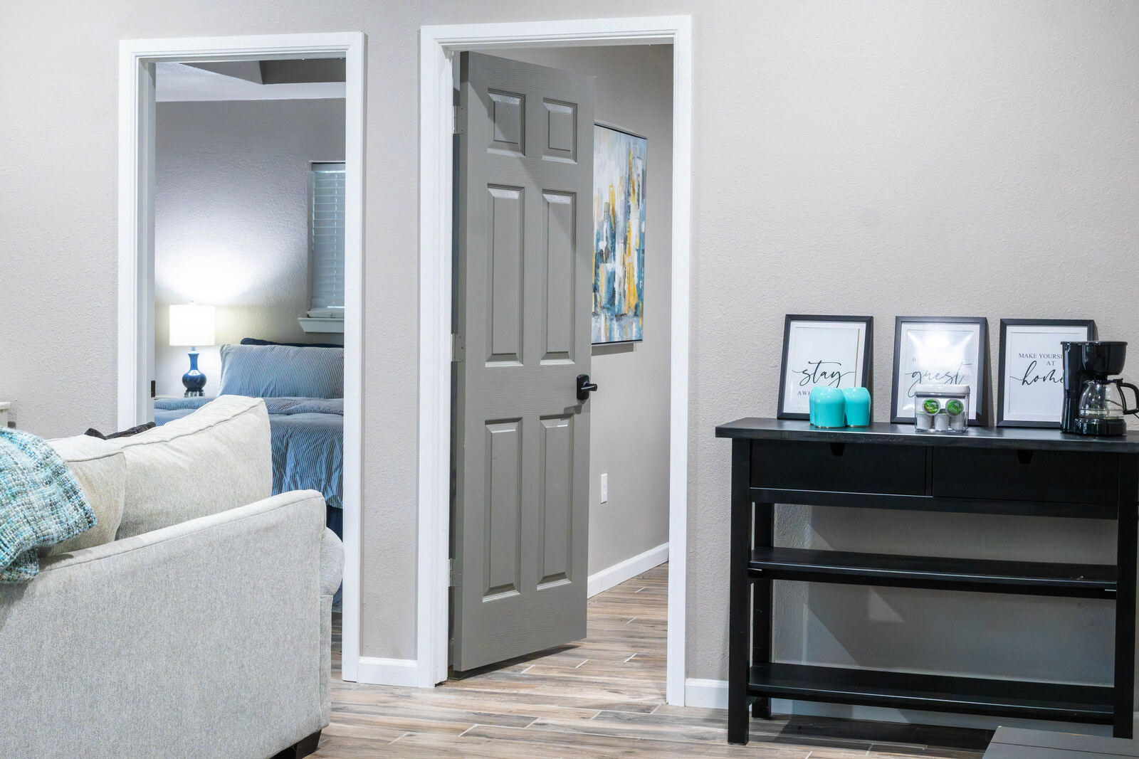 Inside the casita — living room with both bedroom doors and the coffee bar