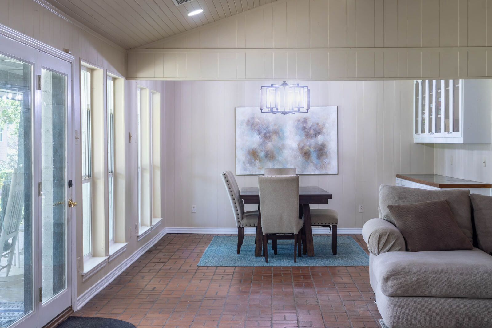 Vaulted dining room with brick floors