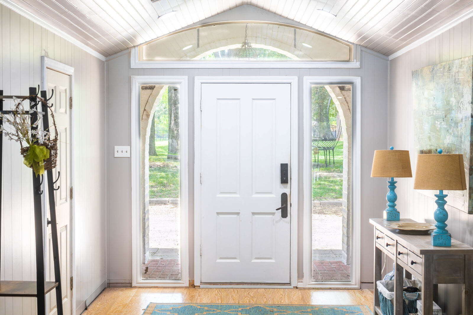 The entry with arched transom and stone arches beyond