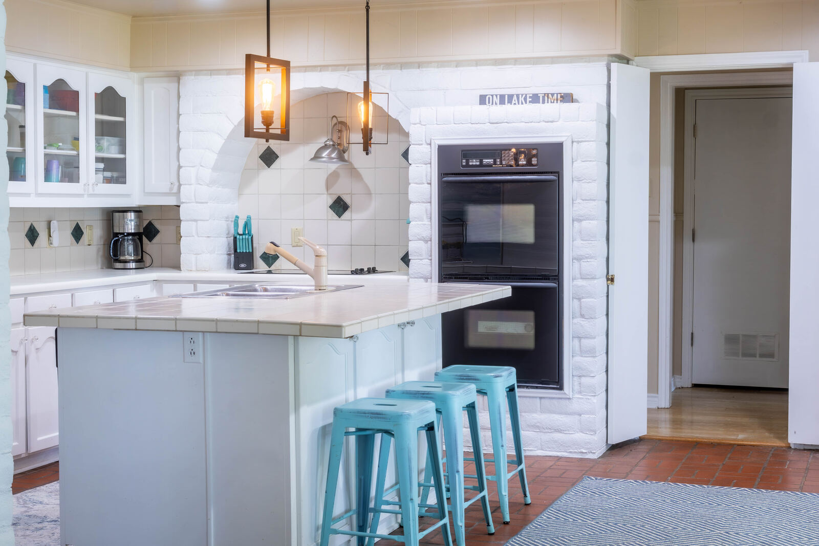 The kitchen — island, double ovens, on lake time